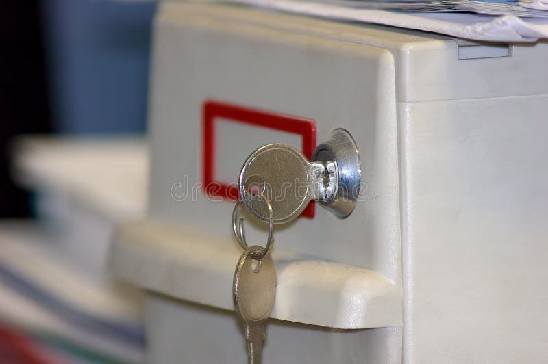 Small personal file box for protecting personal documents, computer disks, flash drives, jewels, etc. against theft and fire royalty free stock photo Small personal file box for protecting personal documents, computer disks, flash drives, jewels, etc. against theft and fire royalty free stock photo