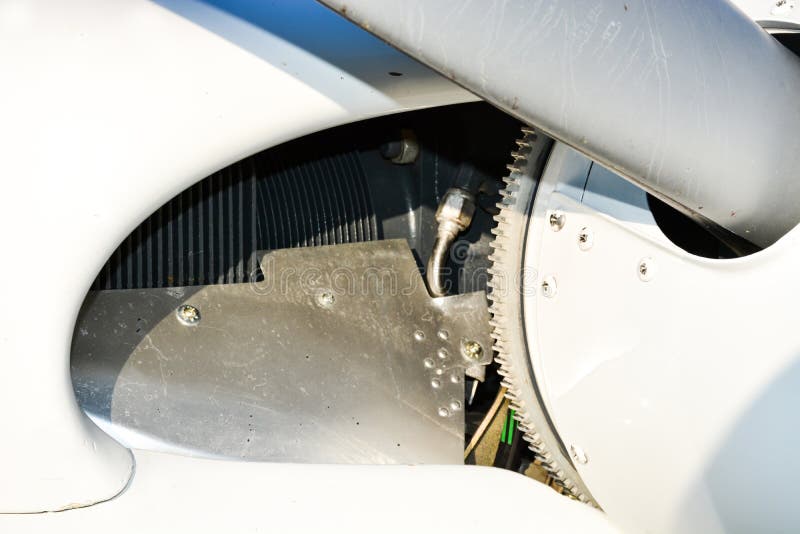 Small plane on the runway, airplane barn, Engine and propeller of small private lightweight vintage airplane closeup