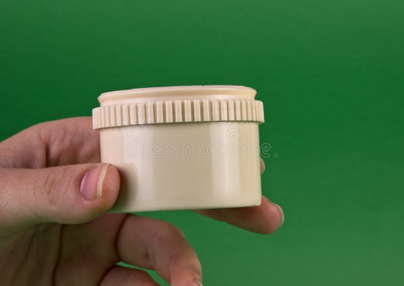 Small Plastic Container in Hand Stock Image - Image of gift, safe: 28601427