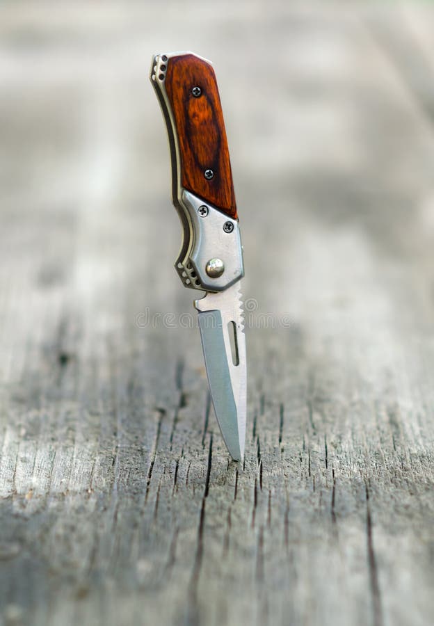 Small Pocket Knife Stabbed Into Wooden Table Stock Photo Image of