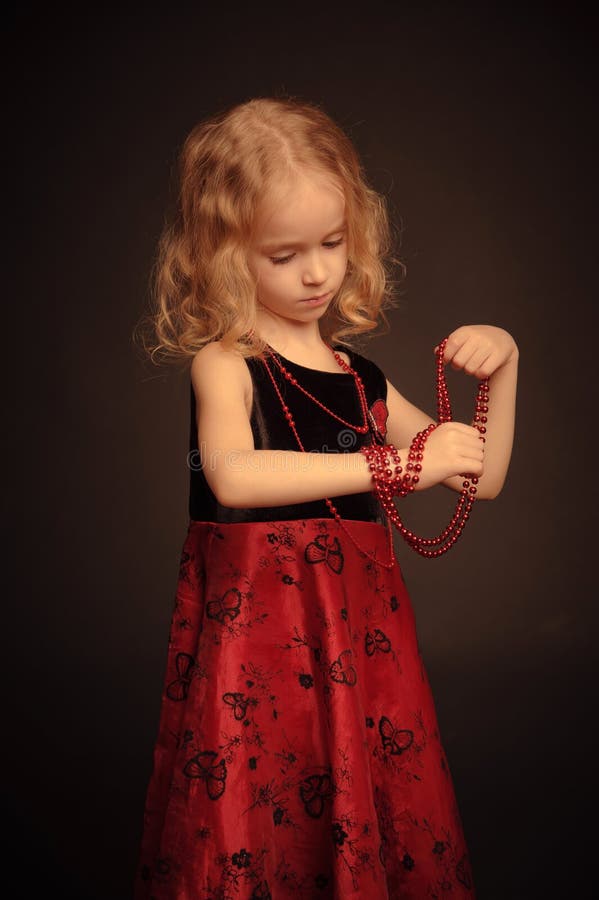 Small pretty girl with beads