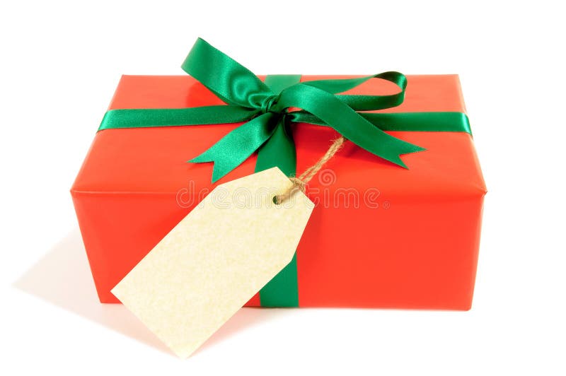 Small red christmas or birthday gift with green ribbon bow, gift tag or label, isolated on white background