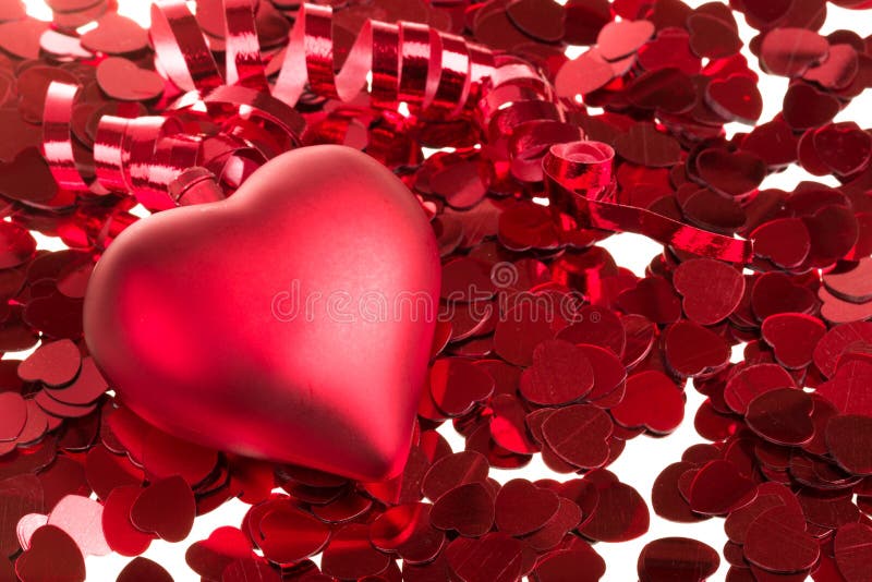 Small Red Confetti and Big Hearts on White Background Stock Photo