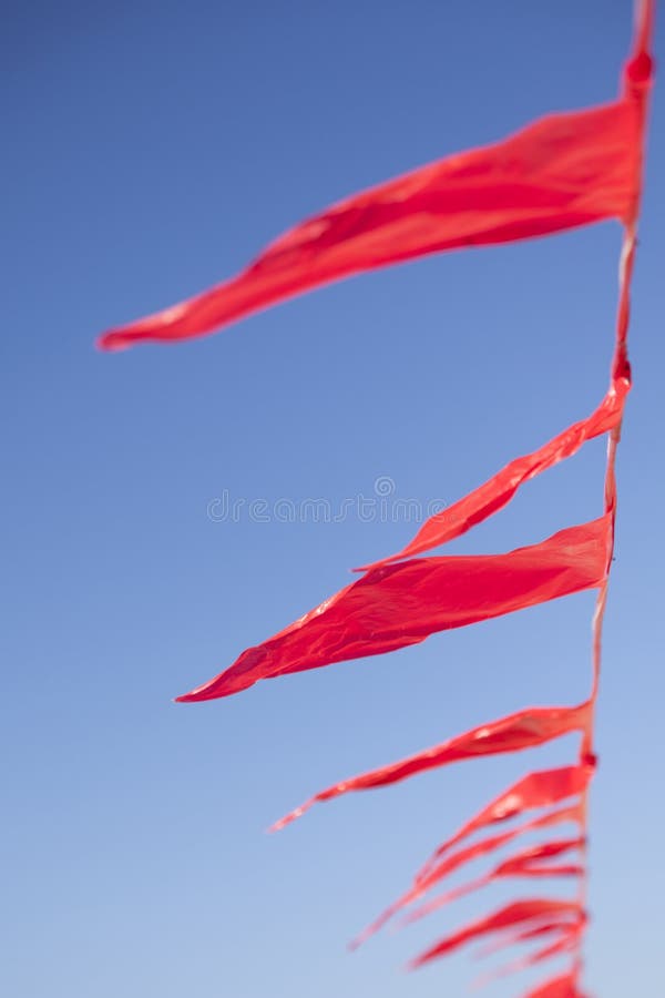 Small Red Flags Against Blue Sly Stock Photo Image of triangular