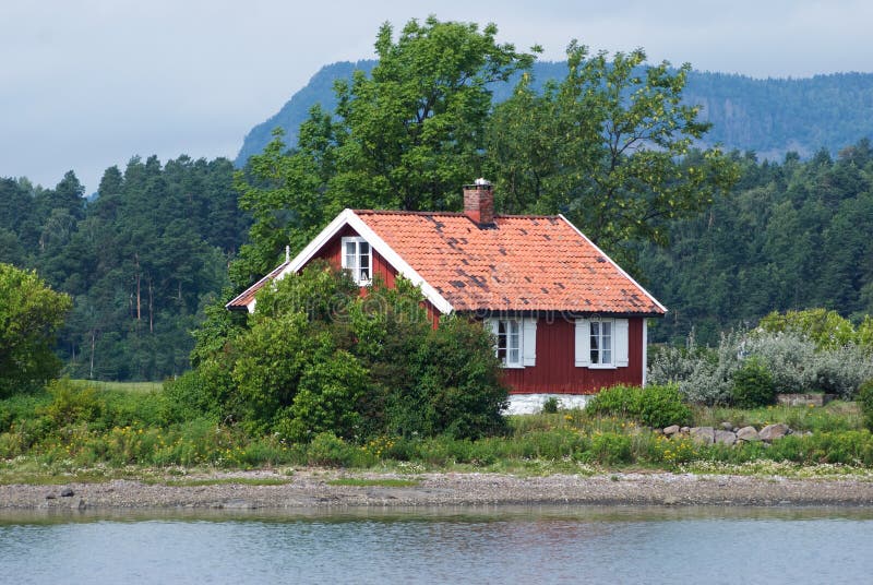 Small, red house by the sea