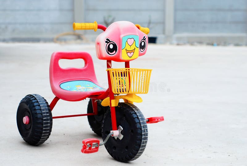 small red tricycle