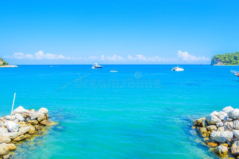 A small river flows into the sea bay in Kemer, Turkey, Antalya