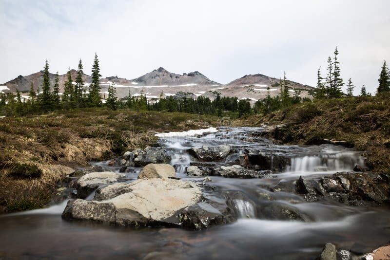 Small rocky stream under distant alpine peaks of Washignton