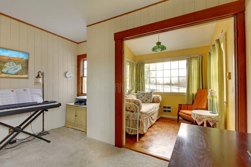 Small Room with Sleeping Sofa and Reading Corner and Music. Stock Photo