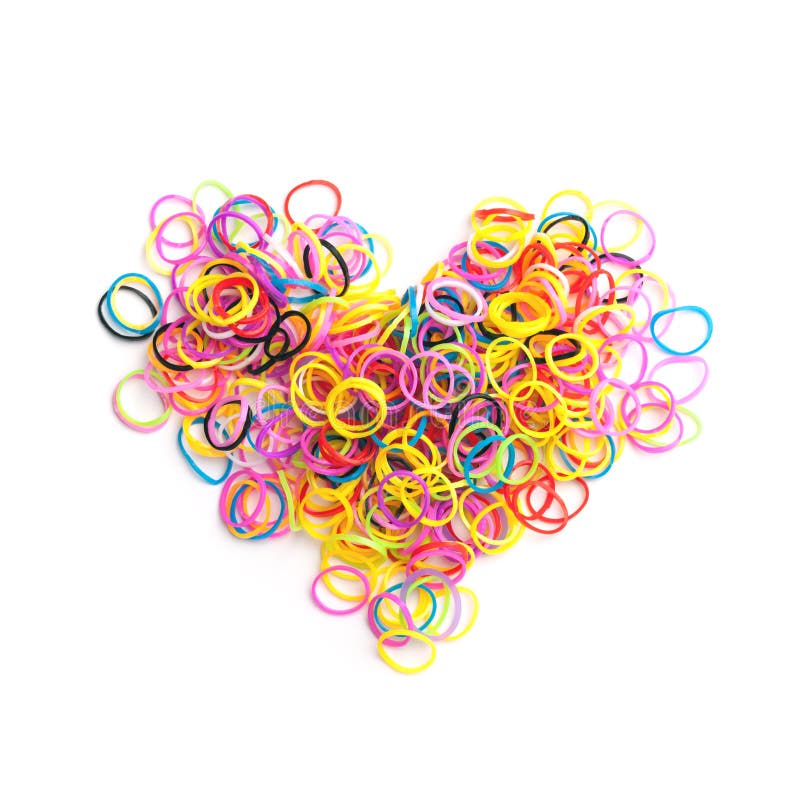 Small round colorful rubber bands for making rainbow loom bracelets in heart shape isolated on white background. Small round colorful rubber bands for making rainbow loom bracelets in heart shape isolated on white background