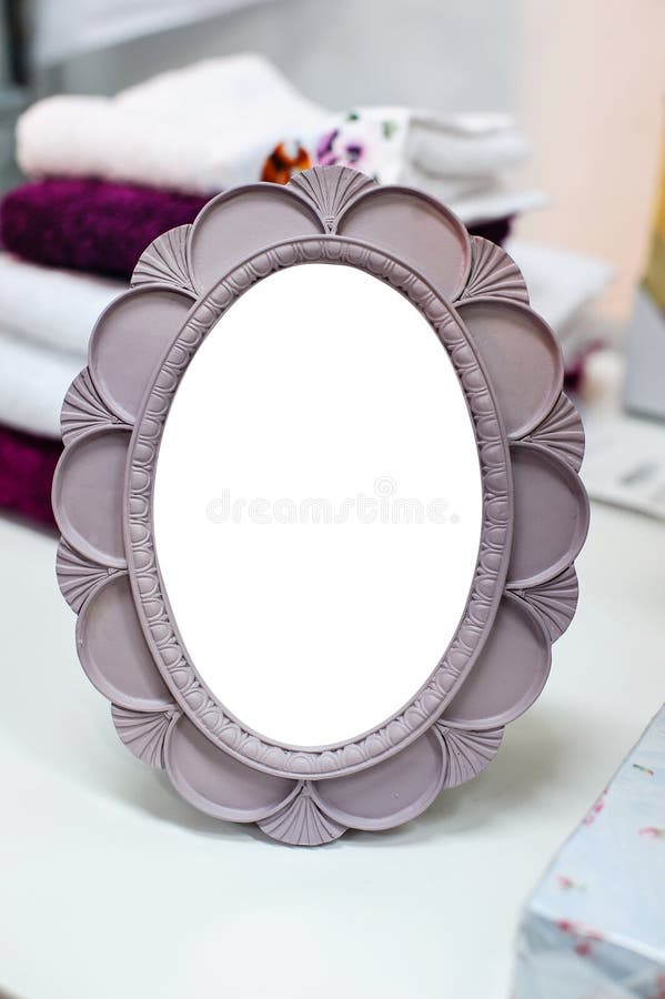 Small round mirror in a frame is on the table. Bathtub stand stock images, royalty-free photos and pictures