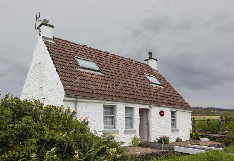 Small scottish croft with a bridge at the front door royalty free stock photo