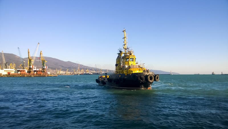 A small service ship in a cargo industrial port. A ship in the s stock images A small service ship in a cargo industrial port. A ship in the s stock images
