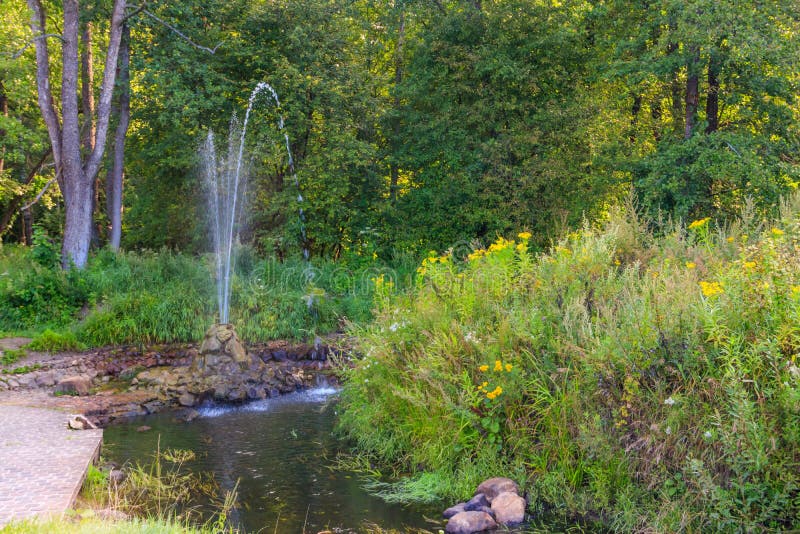 Fountain in the green park stock photo. Image of shape 146534694