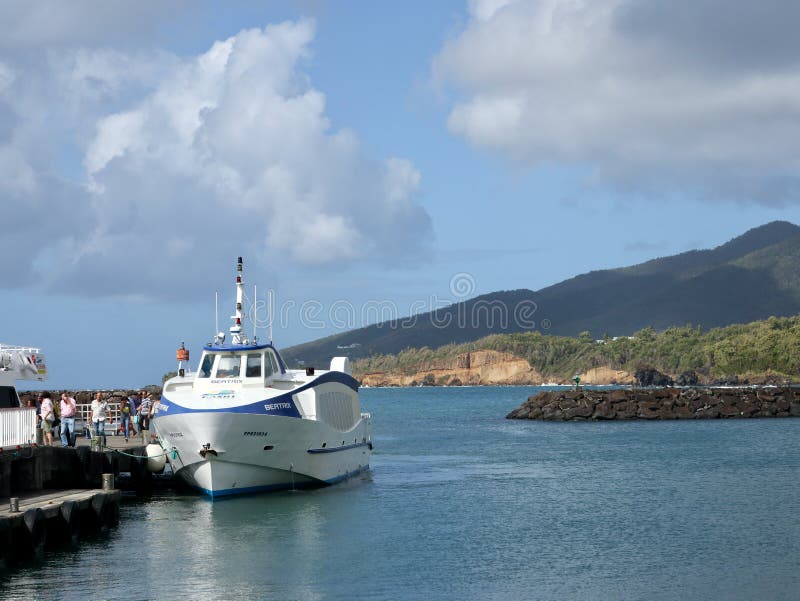 Small Sleek and Fast Ferry Boat at Pier in Caribbean royalty free stock photography