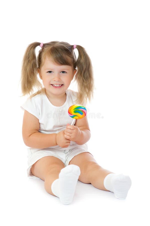 Small smiling girl with lollipop stock photos