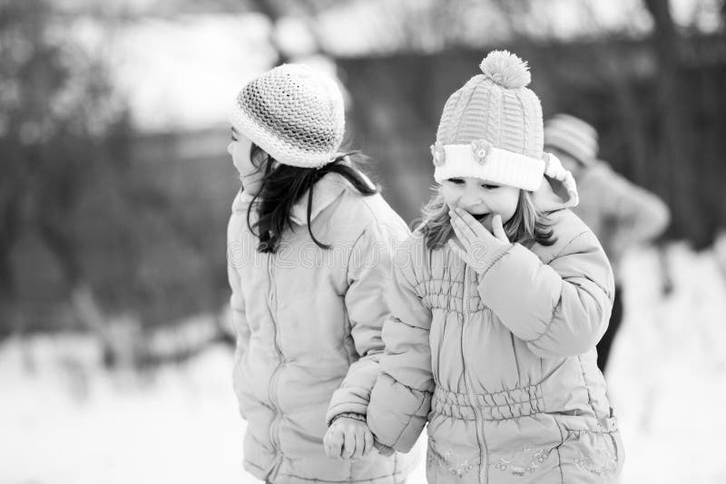 Small southern romanian village. Scenes from a moody winter with children playing with sledges and enjoying the snow