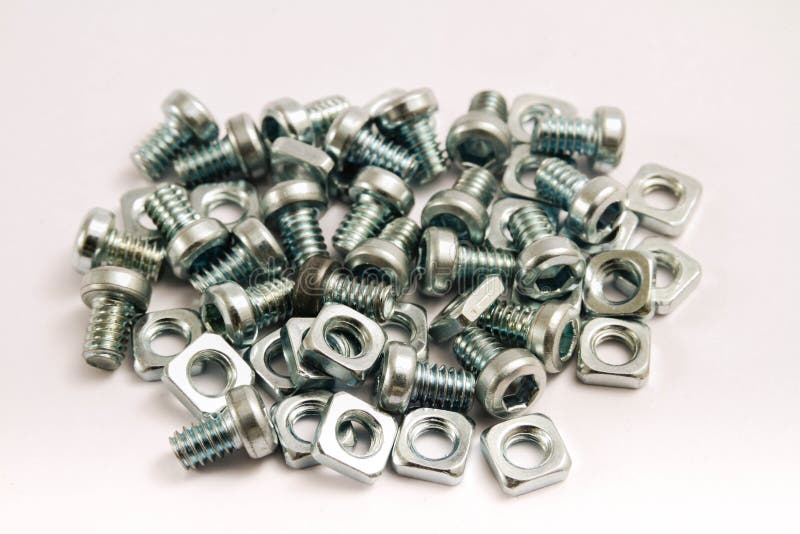 Small steel nuts and bolts stock image. Image of bolts 28865401