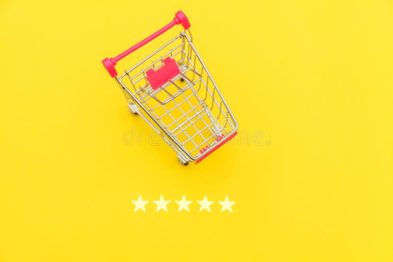 Small supermarket grocery push cart for shopping toy with wheels and 5 stars rating isolated on yellow background