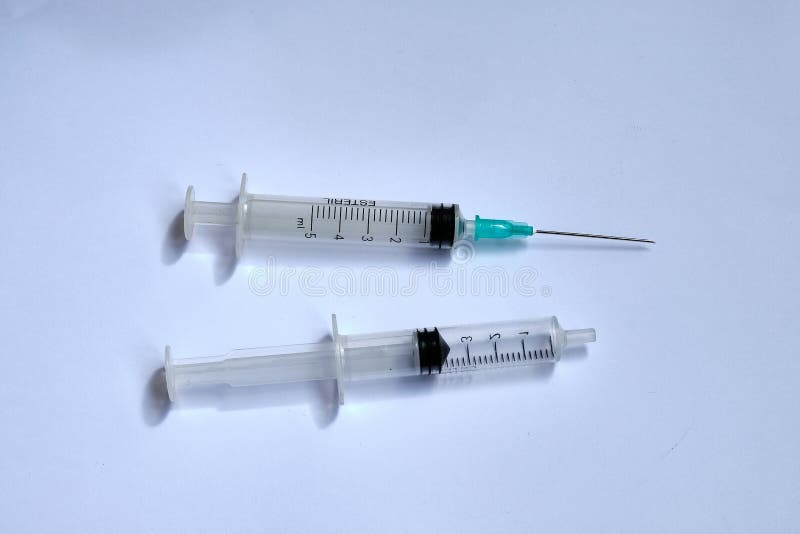 A Small Syringe into Which a Hollow, Sharppointed Bevelcut Needle is