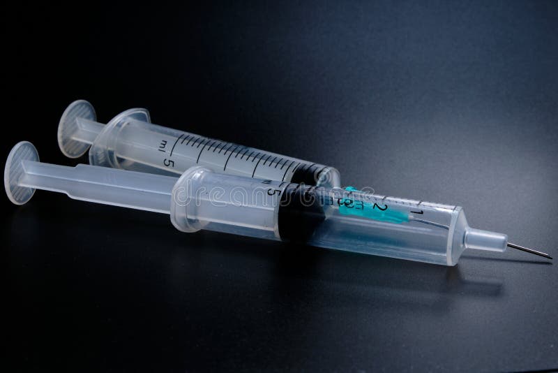 A Small Syringe into Which a Hollow, Sharppointed Bevelcut Needle is