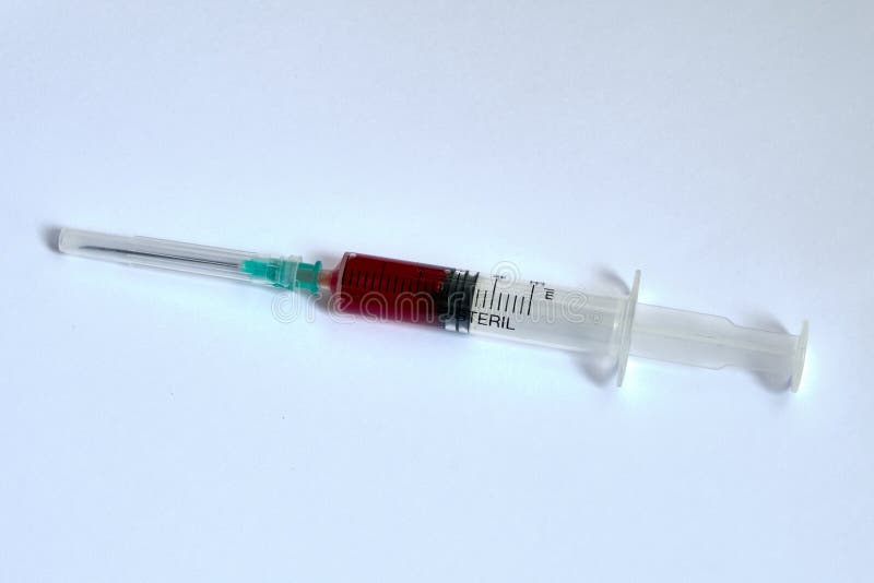 A Small Syringe into Which a Hollow, Sharppointed Bevelcut Needle is