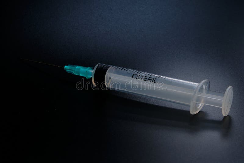 A Small Syringe into Which a Hollow, Sharppointed Bevelcut Needle is