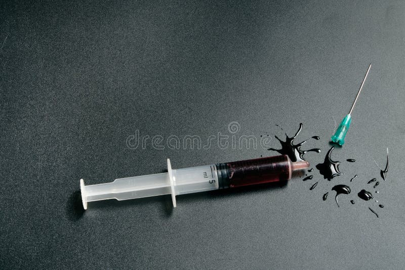 A Small Syringe into Which a Hollow, Sharppointed Bevelcut Needle is