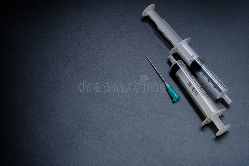 A Small Syringe into Which a Hollow, Sharppointed Bevelcut Needle is