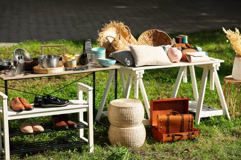 Small Tables with Many Different Items on Garage Sale Outdoors Stock