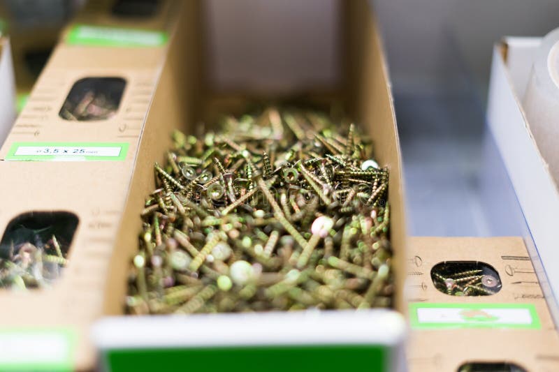 Small Thin Metal Nails, Hardware, Lying in a Store Container. Stock