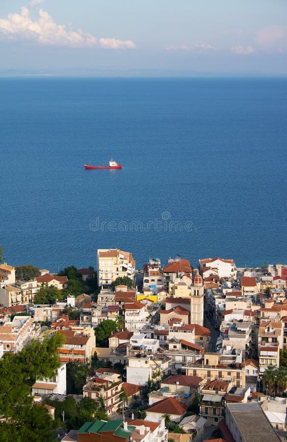 Small town at seaside and ship in sea