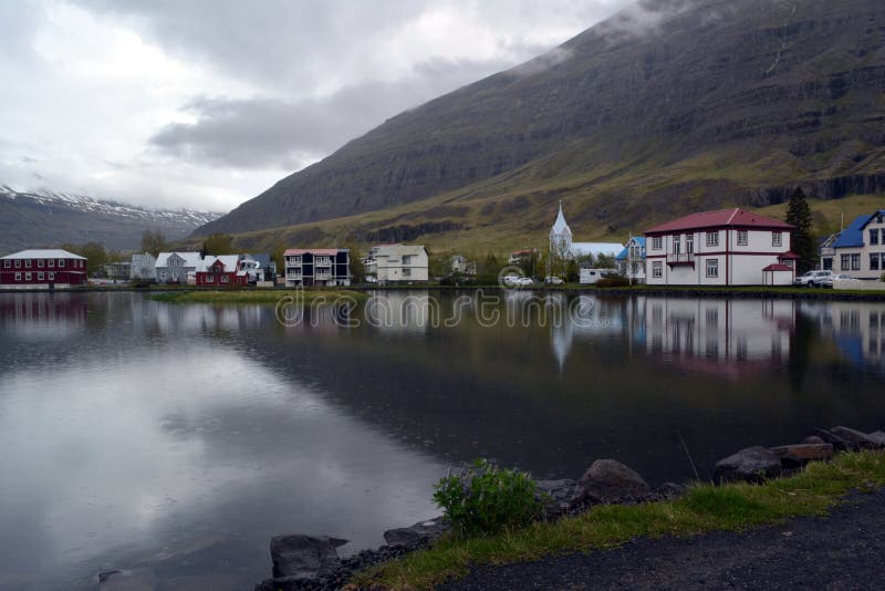 Small town of Seydisfjörður on the shore of the lake in the west of Iceland stock photo Small town of Seydisfjörður on the shore of the lake in the west of Iceland stock photo