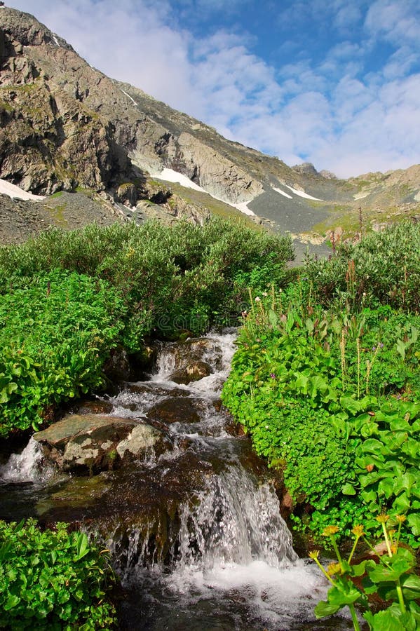 Small waterfall and mountain.