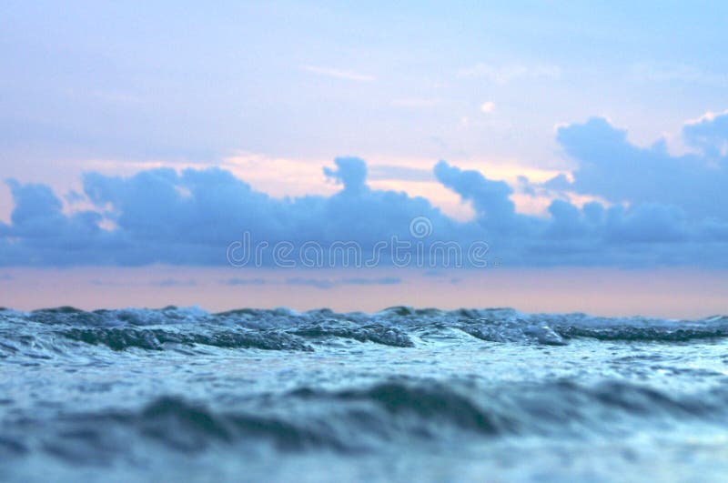 Small waves and stormy sky