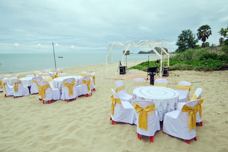 Small wedding party preparation near the sea with table, chair a