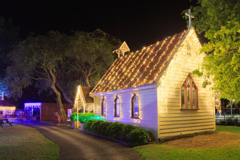 This chapel, built in 1898, is part of the historic village in MOTAT, the Museum of Transport and Technology in Auckland, New Zealand. It is seen here strung with fairy lights during the Christmas season. December 21 2019. This chapel, built in 1898, is part of the historic village in MOTAT, the Museum of Transport and Technology in Auckland, New Zealand. It is seen here strung with fairy lights during the Christmas season. December 21 2019