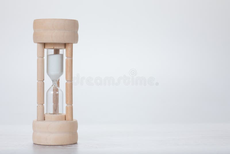 Small wooden egg timer or hourglass