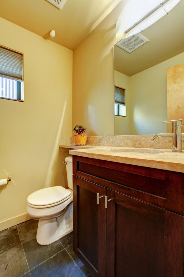 Small Yellow Bathroom with Wood. Stock Image Image of real, floor