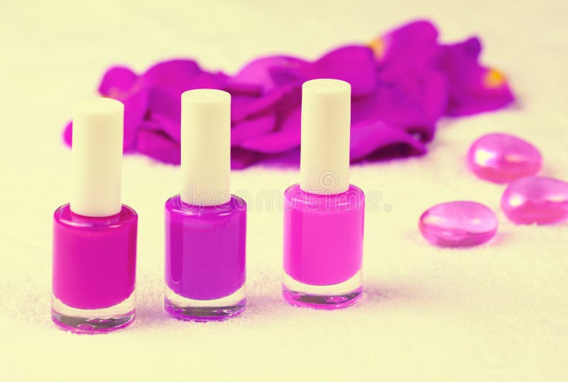 Nail polish for manicure decorated with rose petals. Nail polish for manicure decorated with rose petals