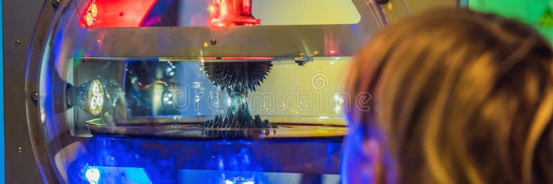 Smart boy scientist making physical experiments in the laboratory. Educational concept. Discovery BANNER, LONG FORMAT royalty free stock image Smart boy scientist making physical experiments in the laboratory. Educational concept. Discovery BANNER, LONG FORMAT royalty free stock image