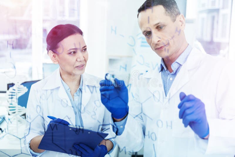 Smart Creative Scientists Developing a Chemical Formula Stock Photo