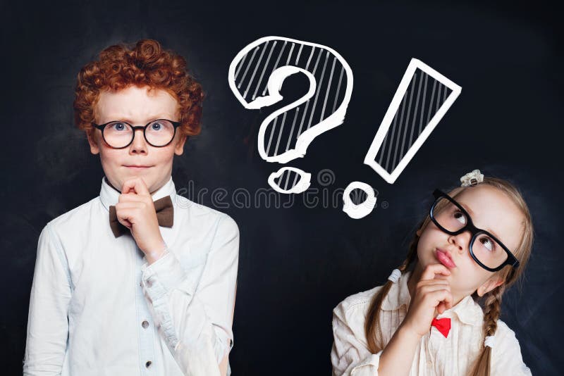 Smart cute thinking kids little girl and boy school student with question mark on chalkboard background. Brainstorming and idea