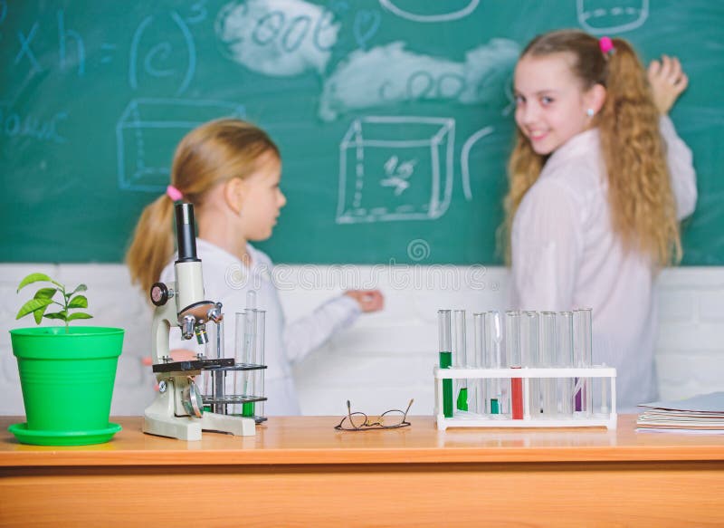 Smart Cuties. School Children in Science Classroom. Microscope and