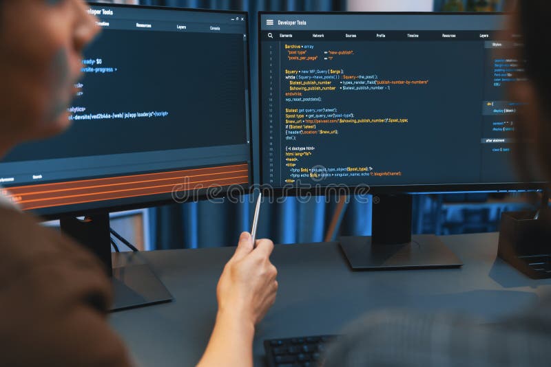 Smart IT developer looking at coding program application on computer screen of online website at back side, analyzing intelligent database system development on business marketing at office. Infobahn. Program coding working stock images, royalty-free photos and pictures
