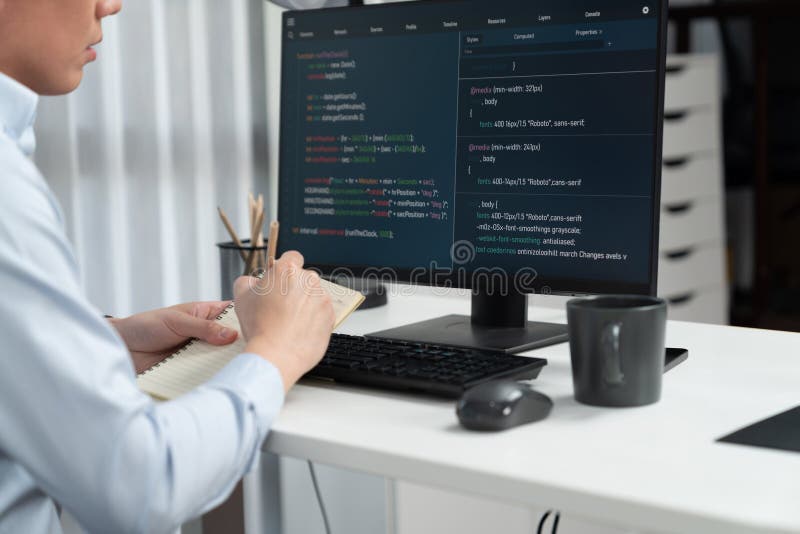 Smart IT developer looking at coding program application on computer screen of online website, analyzing intelligent database system development on business world market at modern office. Infobahn. World coding developer programmer stock images, royalty-free photos and pictures