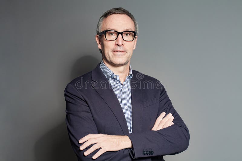 Smart Friendly Professional Man Wearing Glasses on Grey Background