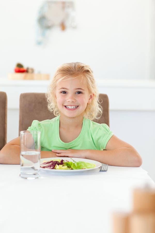 Smart girl sitting eat her healthy salad