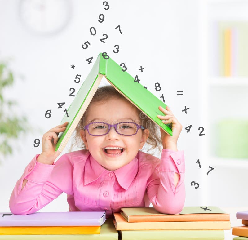 Smart kid in glasses under falling digits royalty free stock photo