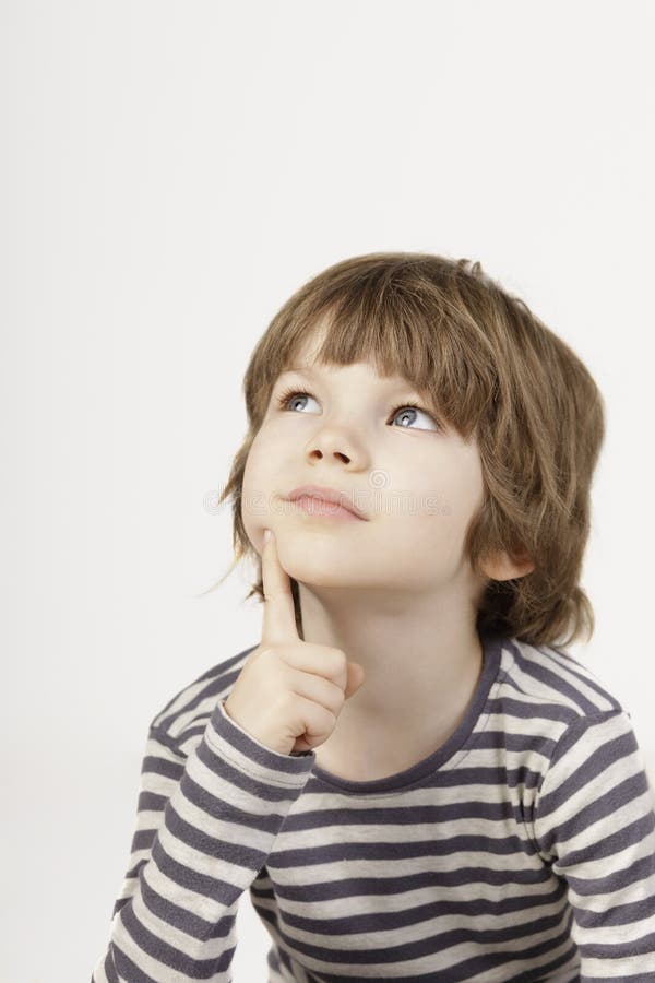 Smart little boy with serious thinking face the white background. stock image Smart little boy with serious thinking face the white background. stock image
